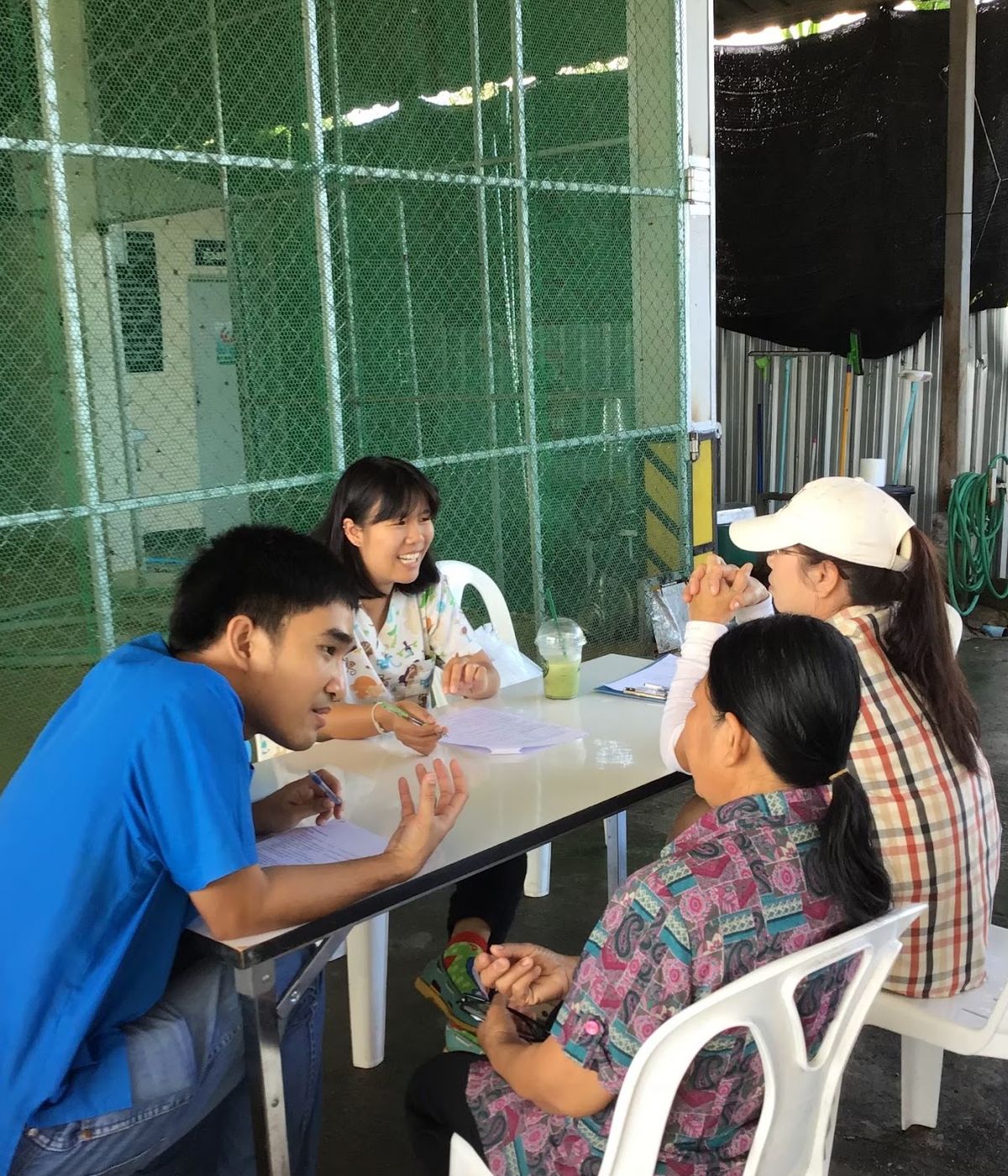 Trainees interviewing farmers during a field outbreak investigation